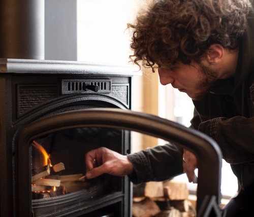 guy lighting a fire