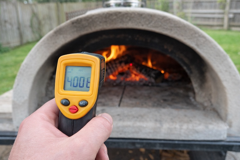 wood fired pizza cooking in an oven