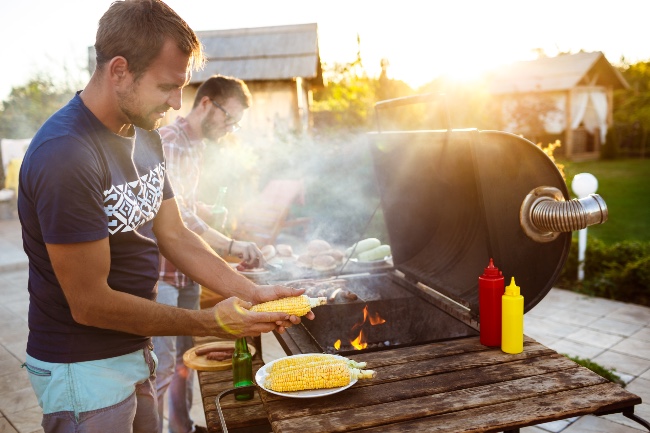 two chaps using smoking wood produts on the bbq